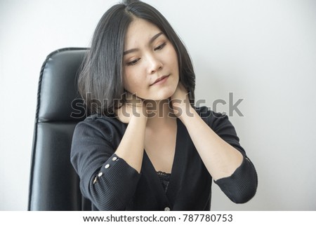 Businesswoman feeling pain in neck after sitting at desk. Tired woman suffering of office syndrome after long hours work on computer. Entrepreneur massaging his tense neck 