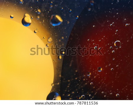 abstract colorful backdrop with oil drops on water surface. possible themes for the application - cosmetic advertising, space, fantasy.