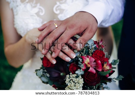 beautiful wedding bouquet in the hands of the couple