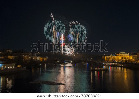 New Year Eve Firework in Prague, Czech Republic.  Big firework and reflection in river Vltava. 