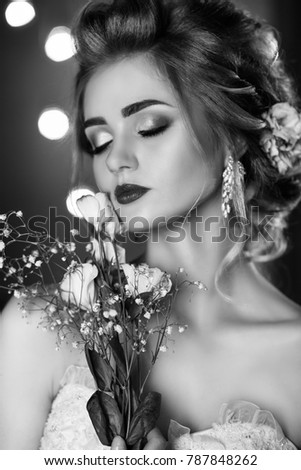 Bride with beautiful make-up and flowers in her hair/black and white
