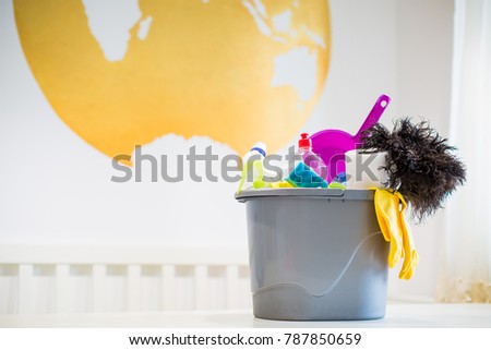 Bucket with different things for cleaning indoors