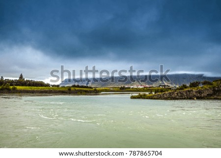 Traditional Icelandic village with houses and beautiful morning landscape.