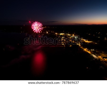 Aerial View Of Fireworks Over Lake At Sunset On Canada Day 