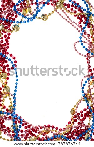 Shiny multi colored mardi gras beads including blue, red, gold and pink on white background. Studio Photo