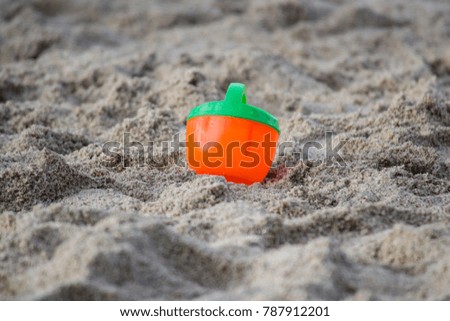 Children toys on a sandy beach