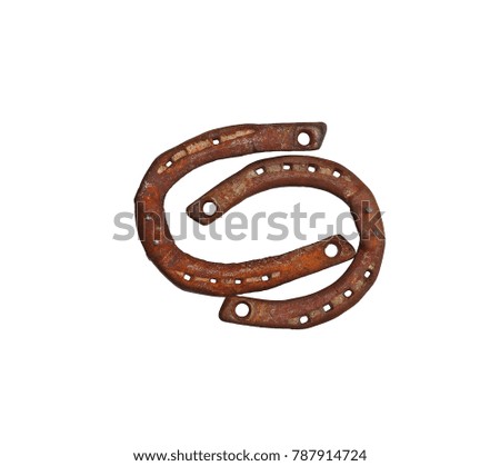 Old rusty horseshoe on white background. Good luck symbol.