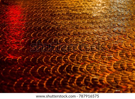 golden yellow structure of a rectangular pavement, road for car, old rock
