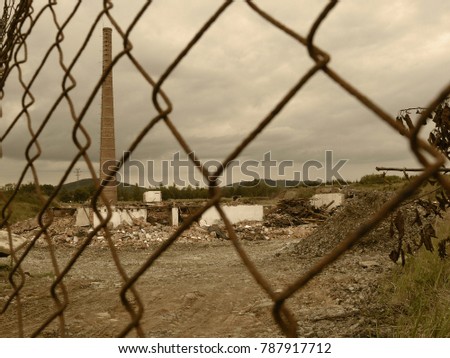 restricted area post-apocalyptic chimney fence ruin sepia polluted