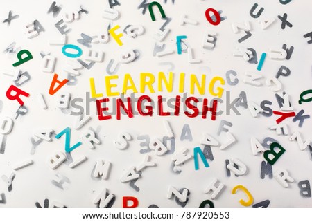 Learning English surrounded by a mix of letters