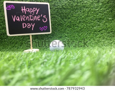 Happy Valentine’s day to golfer sign with golf ball on green grass