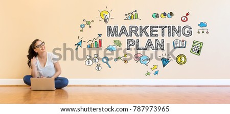 Marketing Plan text with young woman using a laptop computer on floor