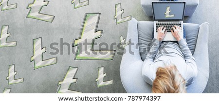 Light Coins with man using a laptop in a modern gray chair