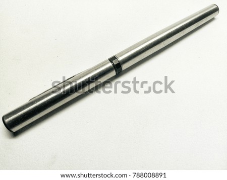 an expensive pen on a white background