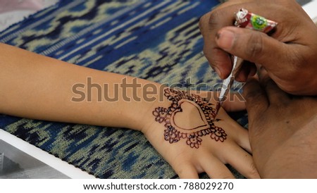 Creative drawing with Henna or inai in Malay and Indian Communities. Popular event during wedding ceremony in Malaysia.