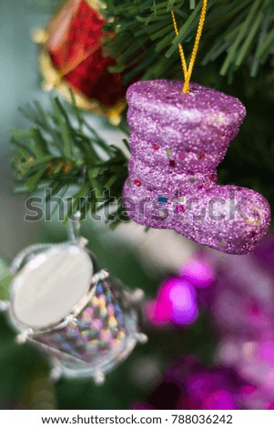 Christmas ornament hanging from a tree with lighting and bokeh in the background, Soft focus and blurry images The origin of the manual lens.