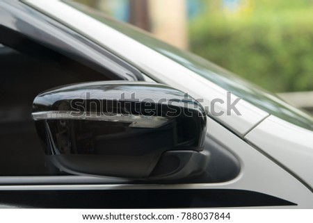 luxury car closed wing mirror after parking for safety drive
