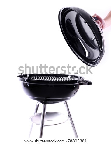A picture of a new black barbecue with a cover over white background