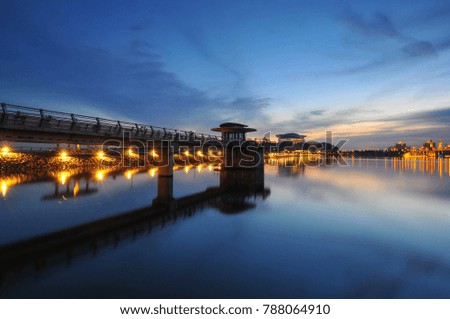 Beautiful sunset with buildings and water in dam in Putrajaya