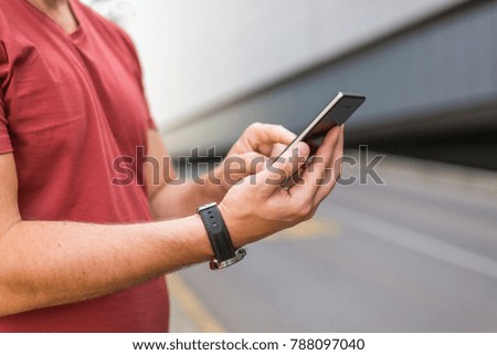 Closeup hands holding smartphone, man using mobile smartphone connected online app. Young business man using mobile smartphone searching or social networks. Communication, technology electronic device