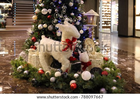 Christmas tree with brilliant ball and white sheep