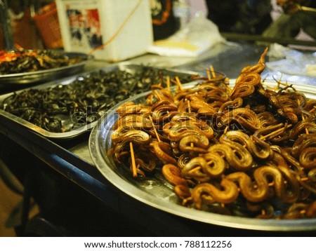 Dry snakes and scorpio, thailand delicacies on the street.