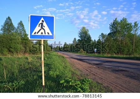road sign near asphalt road