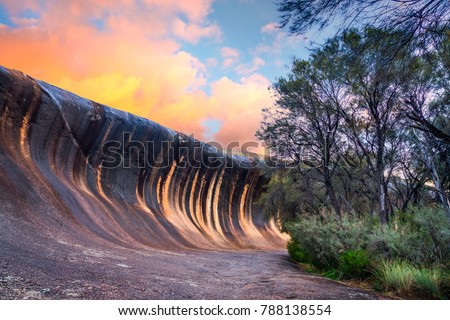 Sunset at Wave Rock near the town of Hyden, in the south west of Western Australia, Australia. Royalty-Free Stock Photo #788138554
