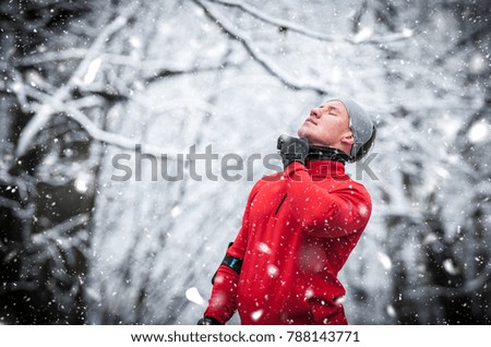 Winter running exercise, runner wearing warm sporty clothes has break