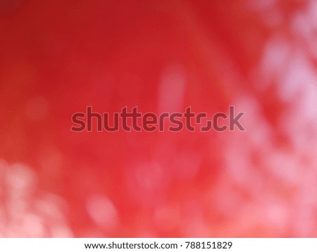 Abstract out of focus lights coming from the mother nature with abstract background of a Red fruit. Abstract background of Red and White color. 