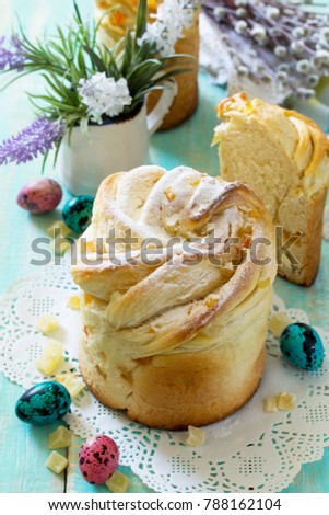 Kruffin sweet pastry - Easter recipe. Traditional food on the holiday table - bread cake with candied Kraffin and easter eggs.