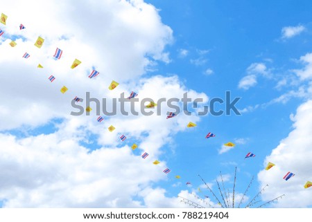 Small Thai Flag and Religious Flag Used in religious ceremonies of Buddhist temples. The back is a bright blue sky.