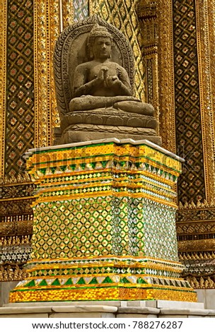 Detail of the entrance to the Phra Mondop (the library), at Wat Phra Kaew temple in Bangkok, Thailand, with fantastic colors of gold and emerald.