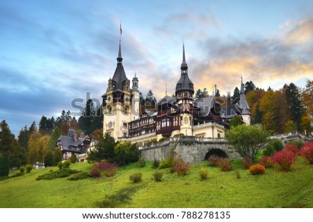 Peles Castle, Romania. Beautiful famous royal castle and ornamental garden in Sinaia landmark of Carpathian Mountains in Europe at sunset. Former Home Of The Romanian Royal Family. 