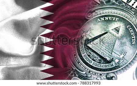Flag of Qatar on a fabric with an American dollar close-up.