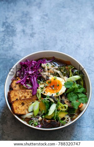 Vegetarian ramen with smoked tofu, pickled cabbage and cucumber