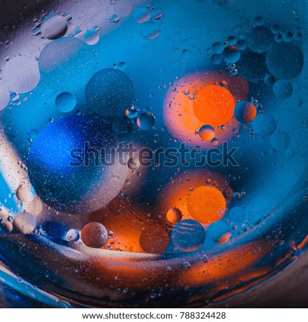 Blue-orange abstraction background macro molecules atoms shooting circles drops planet cosmos galaxy creative art for advertising text