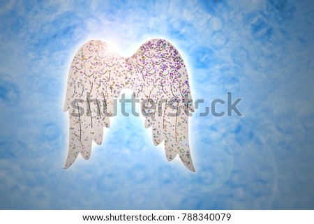 Wings on blue background stock images. Angel wings christmas decorations