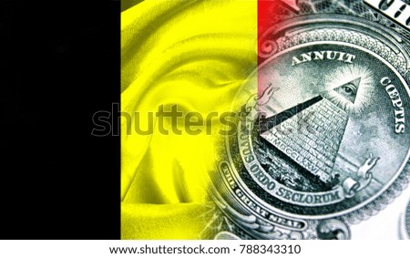 Flag of Belgium on a fabric with an American dollar close-up.