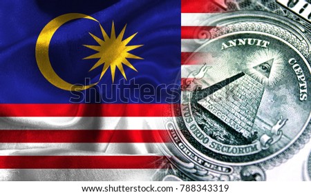 Flag of Malaysia on a fabric with an American dollar close-up.