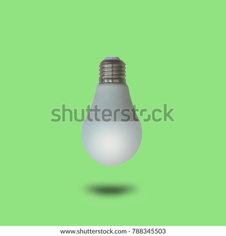 LED Light Bulb on green Background