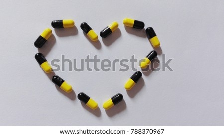 Drugs capsule isolated on white background,heart drug picture 