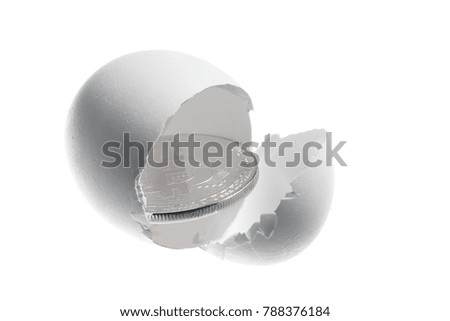 Bitcoin gold coin in egg shell isolated on white background