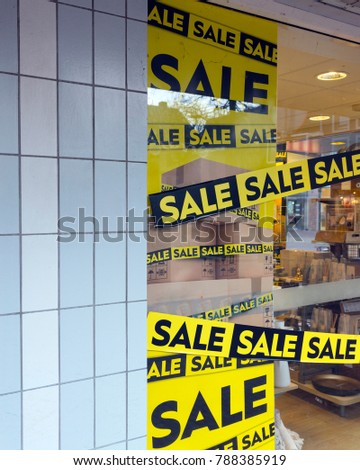 the word sale oin colorful display in shopping window during winter sale time