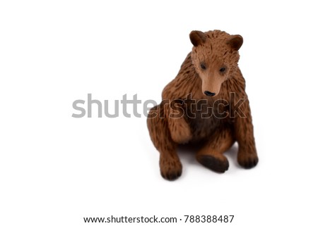 Bear stock images. Brown bear isolated on white background. Sitting bear image