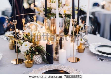 Closeup of reception table decorated for wedding or another catered event dinner Royalty-Free Stock Photo #788388553