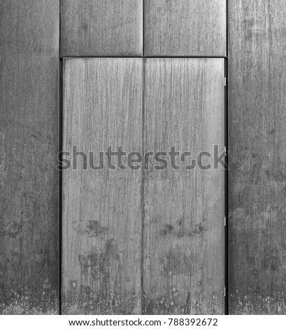 grey brushed steel door set in a metal wall