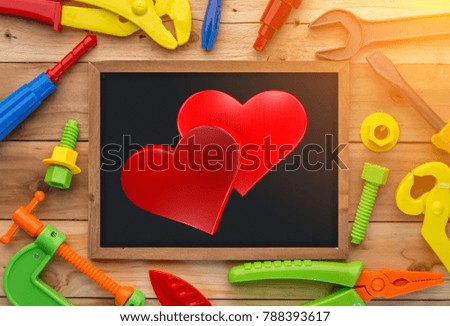 love problem ideas concept with red heart shape object with fix tools background on wooden texture table