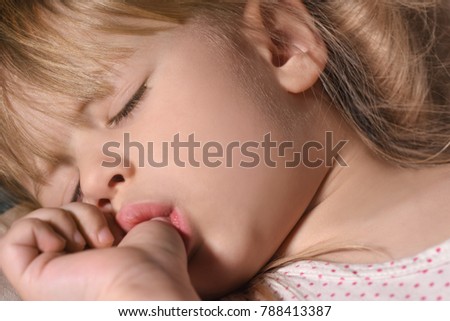 Thumb-sucking medical problem a child sucks a finger Royalty-Free Stock Photo #788413387