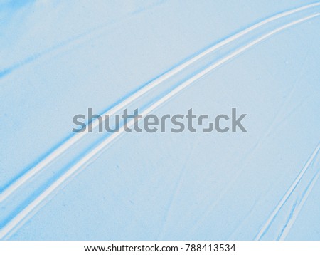 Ski track on blue snow surface, skiing trail